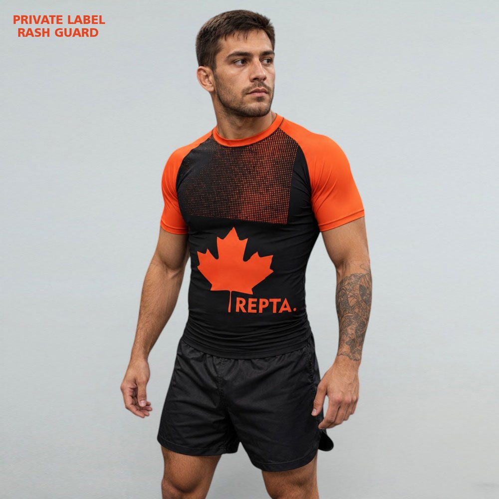 Canada-Inspired-Sublimated-Rash-Guard-Front-View Front view of Canada-inspired sublimated rash guard with black and orange maple leaf design for BJJ and MMA training