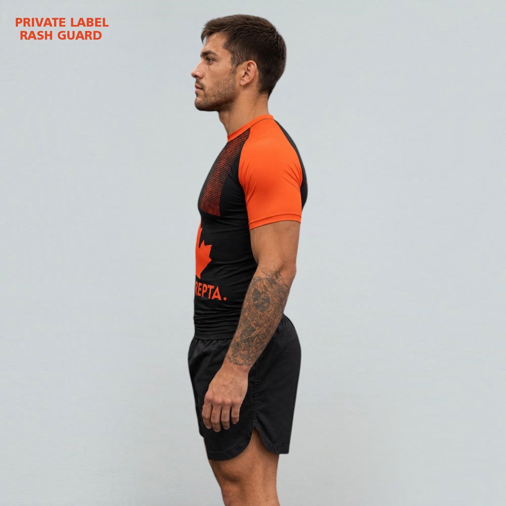Custom-Sublimated-Rash-Guard-Design-Detail Close-up detail of Canada-inspired sublimated rash guard with black orange fabric design and maple leaf graphics